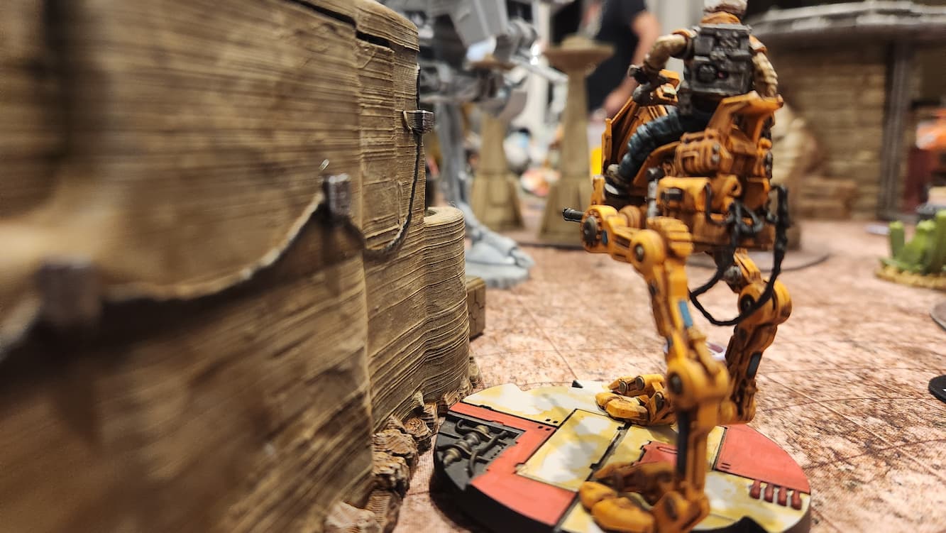 A Rebel AT-RT sneaks up to the Empire Walker